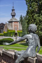 Bronze sculpture of naked girl by count Guy van den Steen in garden of the 16th century Chateau de Jehay