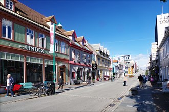 Street with colourful wooden houses and shops