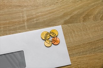 Postage in cent coins on an envelope