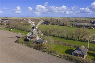 Aerial view over windmill in Oldsum on the island of Foehr in the district of Nordfriesland