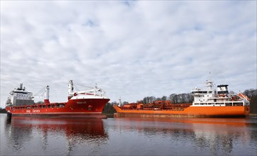 Cargo ship and tanker sailing through the Kiel Canal