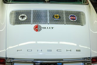 Radiator grille with historic badge in bonnet of historic Porsche 911T 911 T
