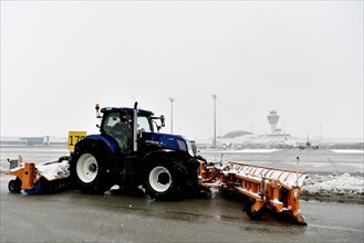 Snow clearing machines and snow removal tractors clearing snow on the east apron