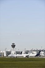 Lufthansa aircraft Airbus 321 Neo waiting for take-off clearance on runway south with tower