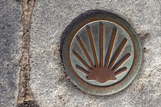 Symbol of the scallop shell in front of the entrance to St. James Church