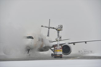 Aircraft de-icing in winter in front of take-off
