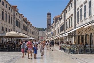 Bell tower and tourists shopping in Stradun