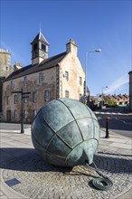 Bronze sculpture Da Lightsome Buoy and the 18th century Old Tolbooth