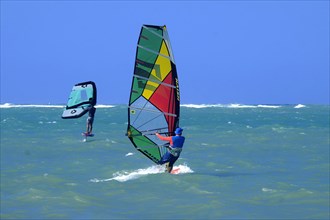 Two windsurfers in the sea off Cabarete