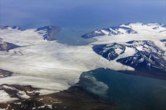 Aerial view of glacier breaking up in sea at Spitsbergen