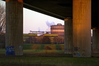Motorway bridge A42 and hot strip slitting line of ThyssenKrupp Steel in the evening light