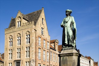 Statue of Northern Renaissance artist Jan Van Eyck in the city Bruges