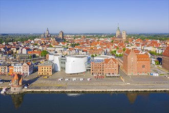 Aerial view over waterfront and public aquarium Ozeaneum in harbour of the Hanseatic City of Stralsund in summer