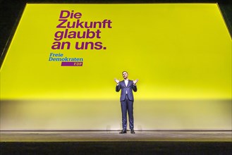 Christian Lindner alone on a large stage