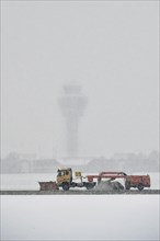 Sweepers clear snow on the southern runway
