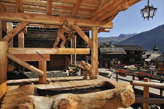 Swiss wooden carpenter sculpture in the Alpine village Grimentz