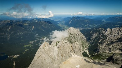 Beautiful view from the top of the surrounding peaks and the village below. Zugspitze massif in the bavarian alps, Dolomites, Italy, Europe