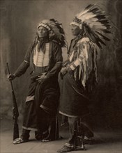 Chief Goes To War, Chief Hollow Horn Bear, two chiefs with feather headdresses, Sioux, North American Indian people, after a painting by F.A.Rinehart, 1899, Historic, digitally restored reproduction o...
