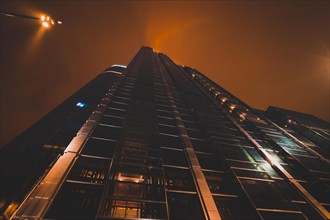 Modern skyscraper at rainy night