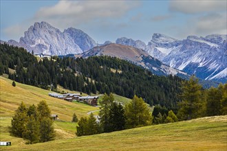 Wellness Resort Adler Mountain Lodge on the Alpe di Siusi, behind the snow-capped peaks of the Geisler and Puez groups, Val Gardena, Dolomites, South Tyrol, Italy, Europe