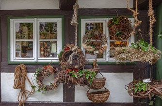 Richly decorated window with basketry, Wernigerode, Harz, Saxony-Anhalt, Germany, Europe