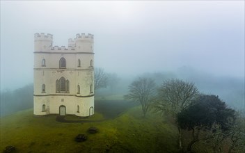 Misty morning over Haldon Belvedere from a drone, Lawrence Castle, Higher Ashton, Exeter, Devon, England, United Kingdom, Europe
