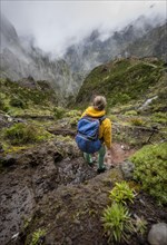 Hiker, Pico Arieiro to Pico Ruivo Hike, Rock Cliff Hiking Trail, Central Mountains of Madeira, Madeira, Portugal, Europe