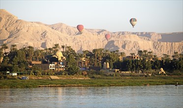 Hot air balloons in Luxor, Eastern Desert behind, Egypt, Africa