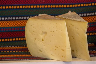 Cuts of kashkaval or kasseri cheese for sale on the shelf
