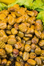 Turkish style prepared olives in the market stands