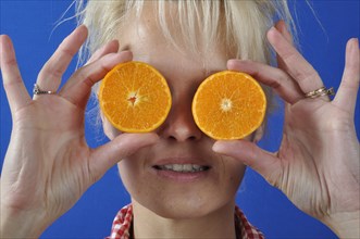 Portrait of womanwith a clementine