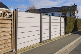 Modern fence in front of terraced house, WPC privacy fence, North Rhine-Westphalia, Germany, Europe
