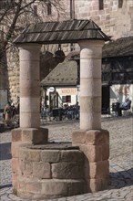 Historical draw well, Tirgaertnertorplatz, Nuremberg, Middle Franconia, Bavaria, Germany, Europe