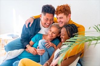 Lgtb couples of gay boys and girls lesbian in a portrait on a sofa at a house party