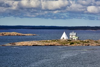 Old pilot station Kobba Klintar with museum, cafe and exhibition building in the shape of a pyramid, small island in the archipelago, harbour entrance Mariehamn, Aland Islands, Gulf of Bothnia, Baltic...