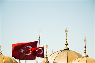 Turkish national flag and domes in open air