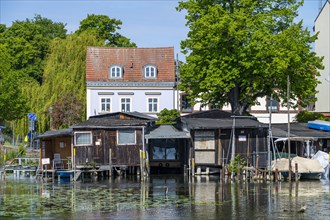 Fishermens boathouses and residential houses on the Brandenburg city canal, Brandenburg an der Havel, Brandenburg, Germany, Europe