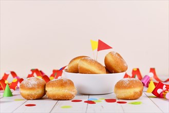 German traditional 'Berliner Pfannkuchen', a donut without hole filled with jam. Traditional served during carnival