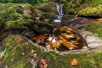 Waterfall falling over Mossy Rocks in the Vosges Mountains. Alsace, France, Europe
