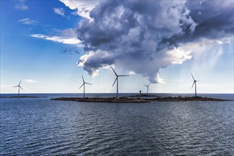 Wind turbines on small islands, Lilla Batskaer and Stora Batskaer, wind turbine, wind farm in the archipelago, Smart Energy Aland project, storm clouds, Mariehamn, Aland Islands, Gulf of Bothnia, Balt...