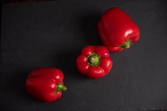 Red peppers on slate, fitness, cooking, vegetarian, vegan, vitamins, growing, healthy, close up, three, kitchen