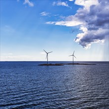 Two wind turbines on small islands, wind turbine, wind farm in the archipelago, Smart Energy Aland project, backlight, Mariehamn, Aland Islands, Gulf of Bothnia, Baltic Sea, Finland, Europe