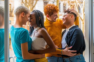 Portrait of couples of gay guys and lesbian girls in a pose of love, lgtb concept