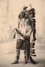 Spies On The Enemy, Chief with feather headdress, Crow, North American Indian tribe, after a painting by F.A.Rinehart, 1899, Historic, digitally restored reproduction of an original from the period