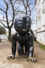 Prague, Czech Republic, February 23, 2023: Famous sculpture Crawling Babies by David Cerny installed outdoors in Kampa Park museum, Europe
