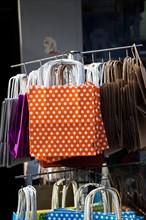 One simple color paper shopping bag in the market place