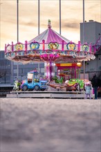 Childrens carousel in the sunset, Constance, Lake Constance, Germany, Europe