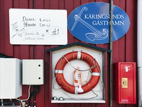 Facade on the boathouse, petrol station for boats, high prices for diesel and petrol, handwritten, energy crisis, harbour in the fishing village of Kaeringsund, Fasta Aland, Aland Islands, Aland Islan...