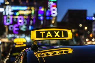 Taxi stand with taxi in the city centre at night, symbol photo, Stuttgart, Baden-Wuerttemberg, Germany, Europe