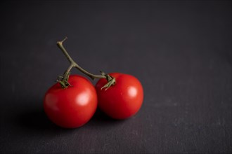Red tomatoes on slate, fitness, cooking, vegetarian, vegan, vitamins, growing, healthy, close up, multiple